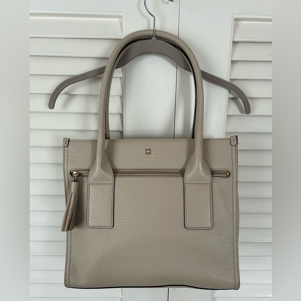 Kate Spade. Never worn or used.